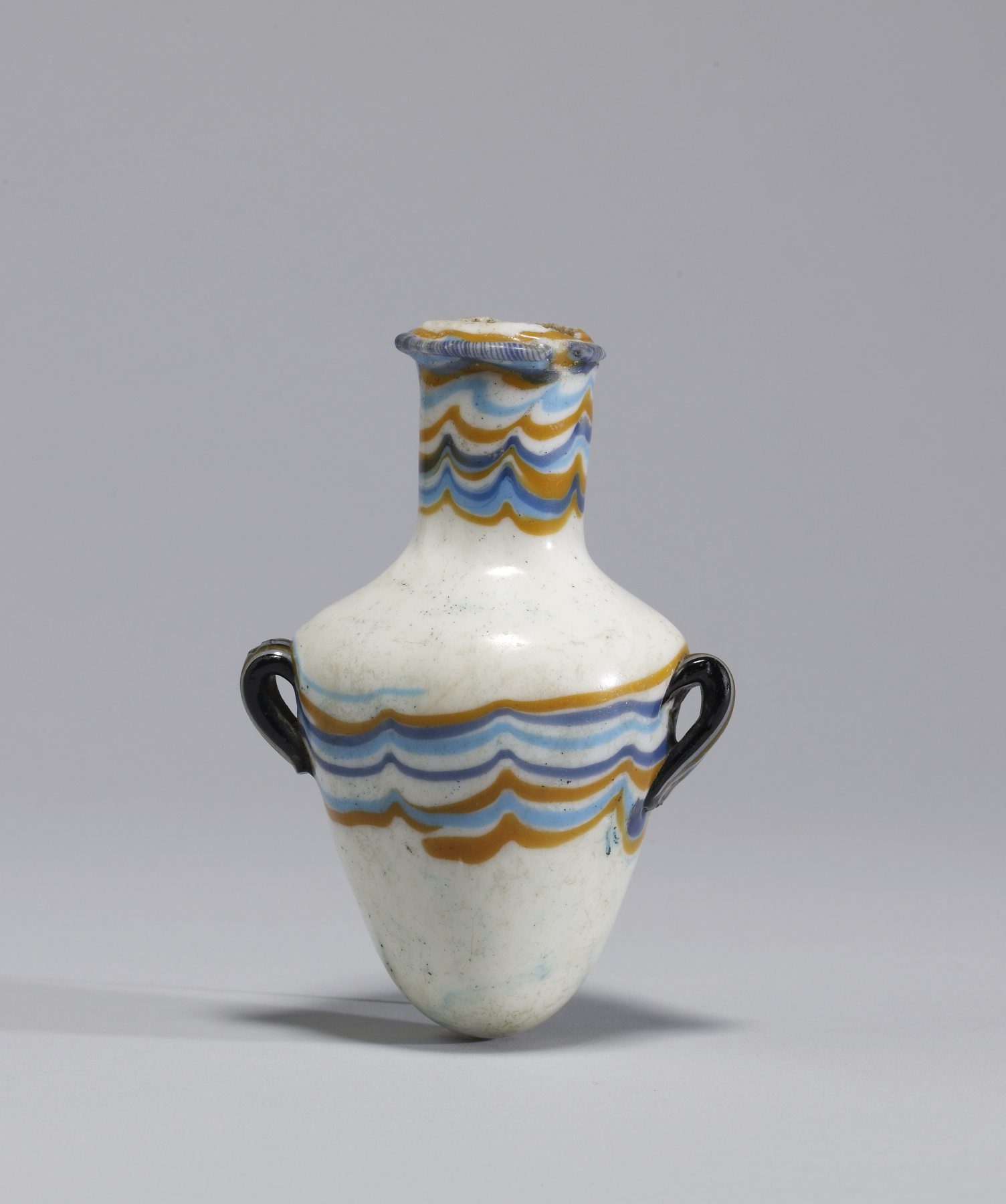 Ancient Egyptian glass vessel with handles